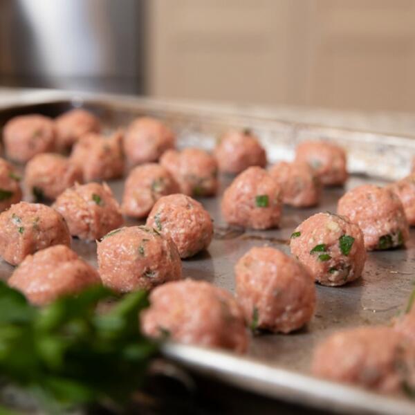 turkey meatballs on sheet pan ready to be baked