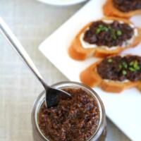 bacon jam in jar with plate of crostini