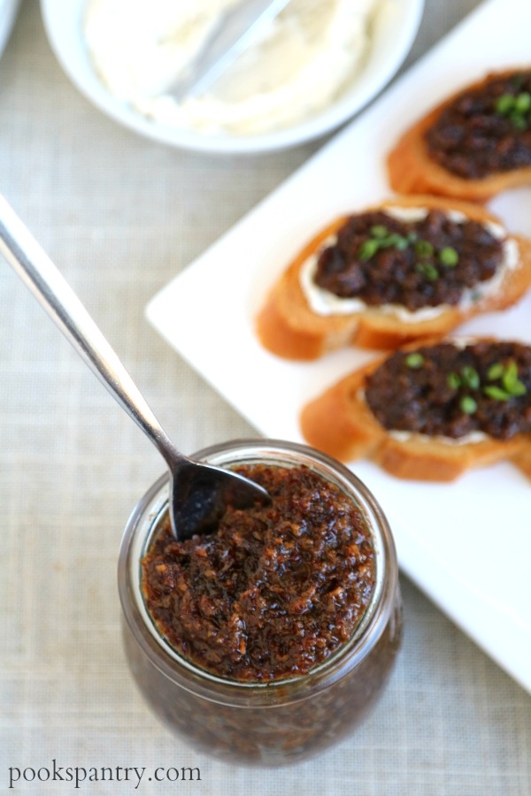 bacon jam in jar with plate of crostini