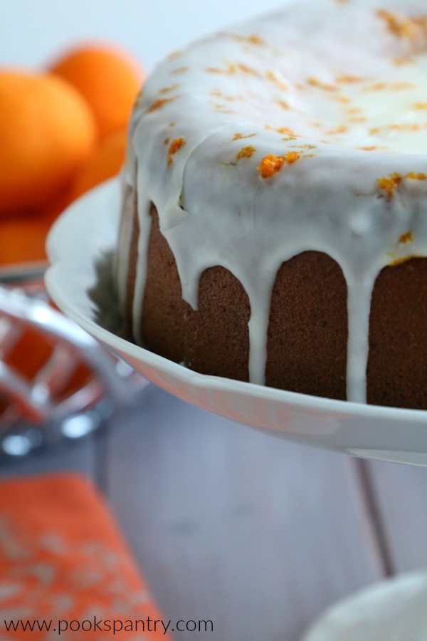 clementine cake on pedestal stand