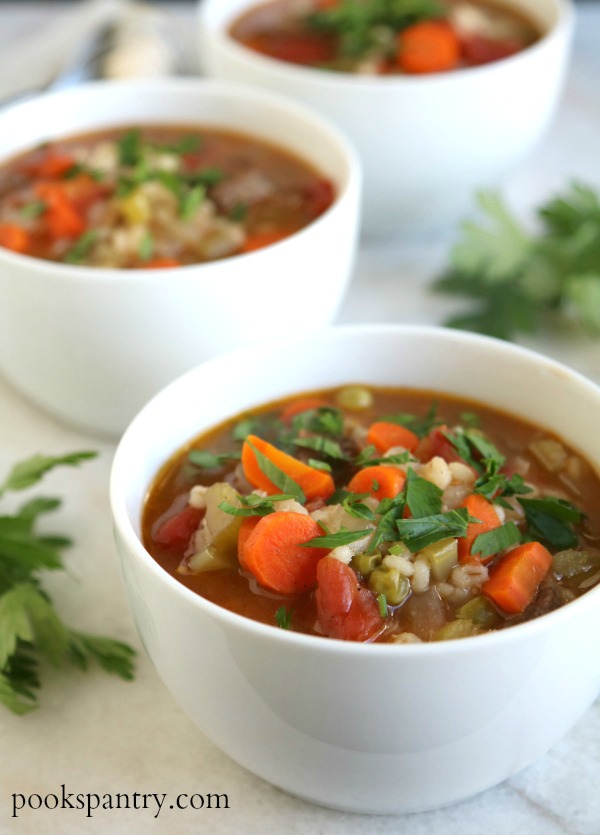 beef barley soup in white bowl