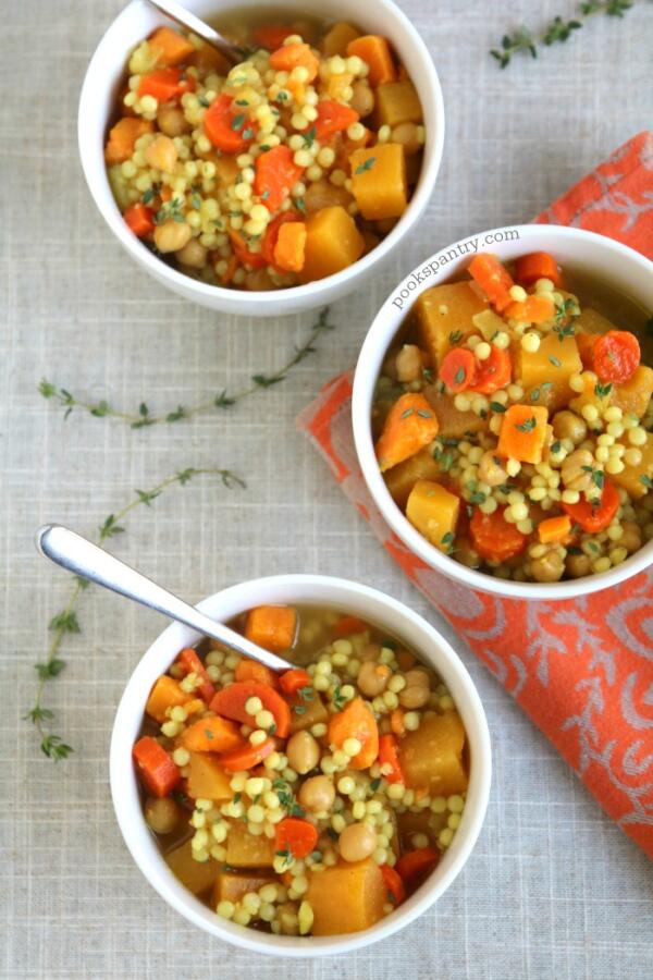 overhead photo of chickpea, couscous and vegetable soup with thyme