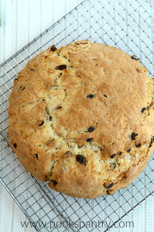 whole loaf of soda bread cooling on rack