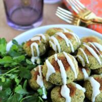 tahini yogurt sauce over falafel