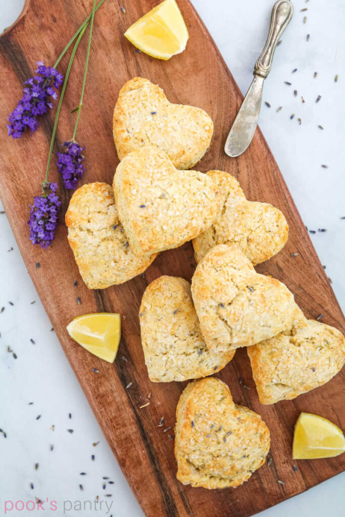 Scones on wooden board with lavender and lemons.