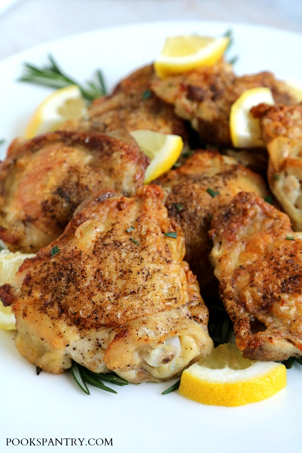 rosemary lemon garlic chicken thighs on platter