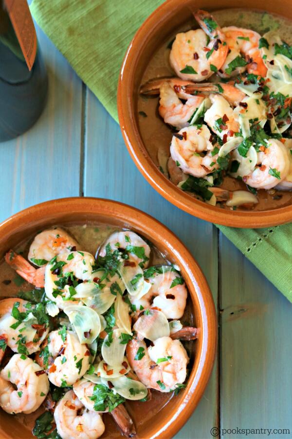 gambas al ajillo with sliced garlic, crushed red pepper and parsley