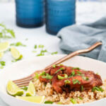 Sweet and spicy slow cooker chicken in bowl.