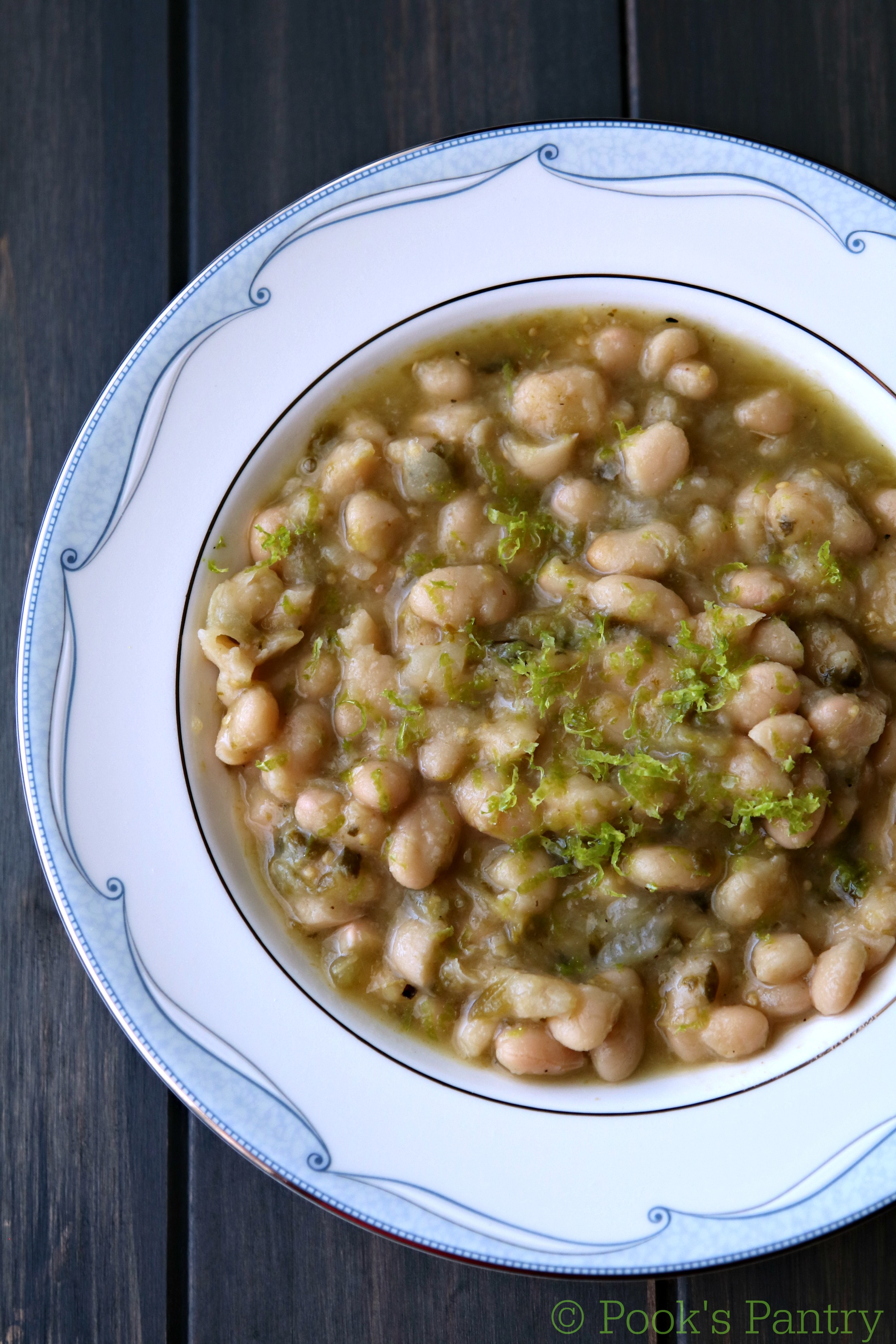 beans with lime zest in blue and white bowl