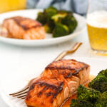 Bourbon salmon recipe with glaze on a white plate with broccoli.