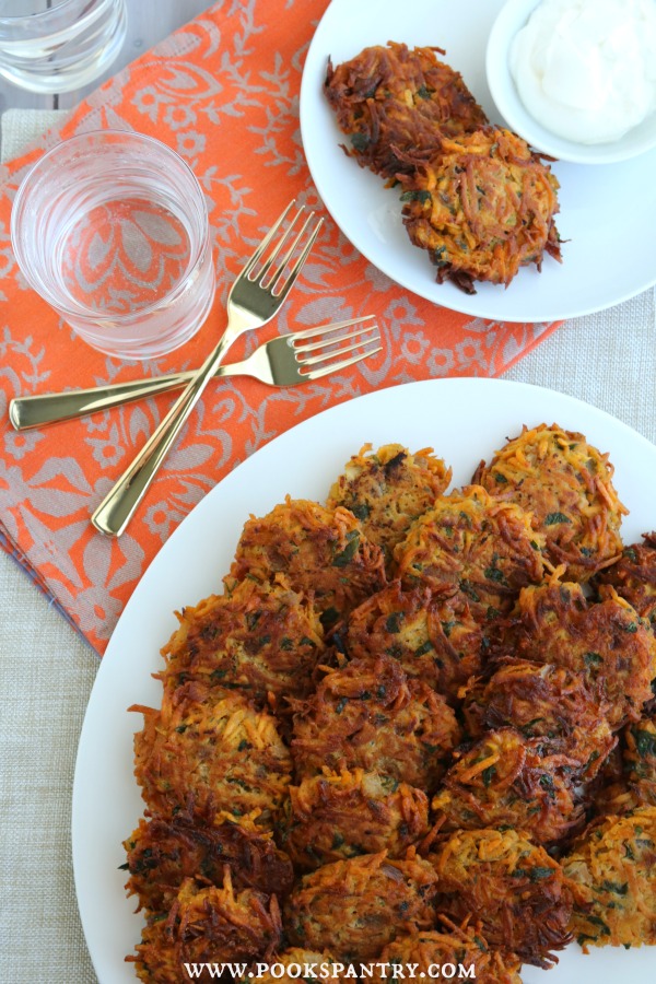 overhead photo of sweet potato cakes on platter with gold forks