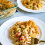 plate of langostino mac and cheese with gold fork