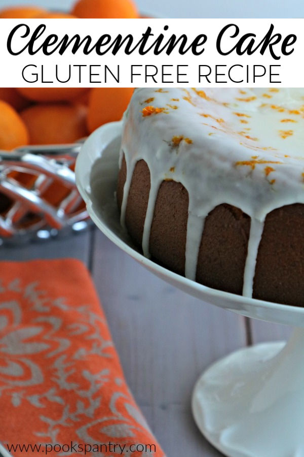 clementine cake on cake stand with glaze