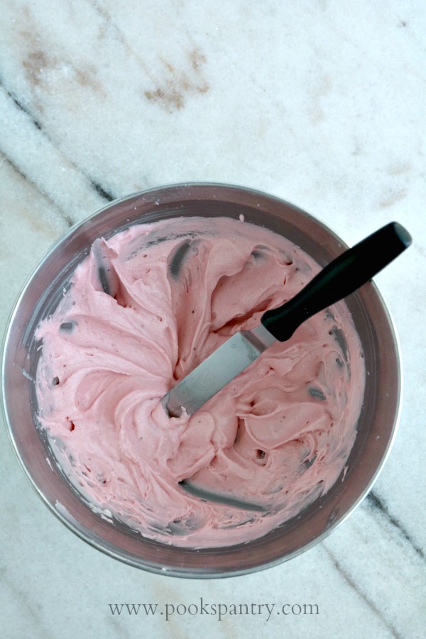 bowl of strawberry cream cheese icing
