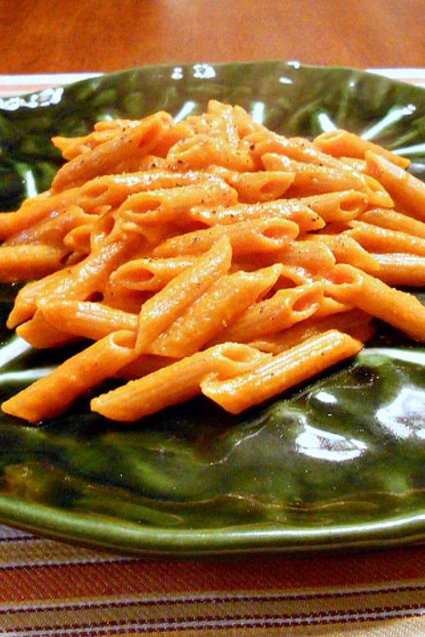 penne with vodka sauce on green plate