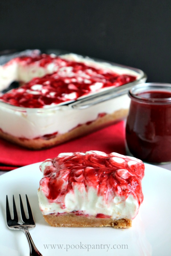 no bake strawberry cheesecake slice on plate with fork