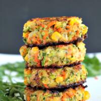 Stack of veggie cakes with black background.