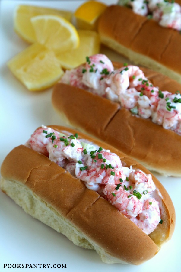 langostino lobster rolls on plate with lemons