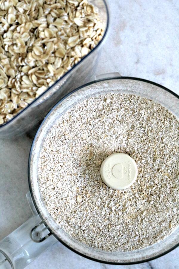 Oatmeal flour in food processor bowl.