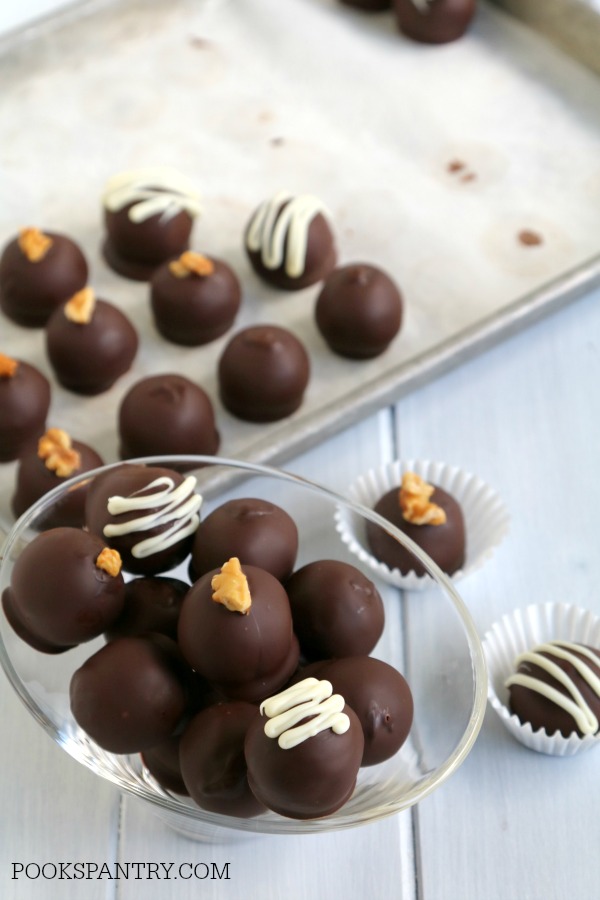 Chocolate covered rum balls in glass bowl