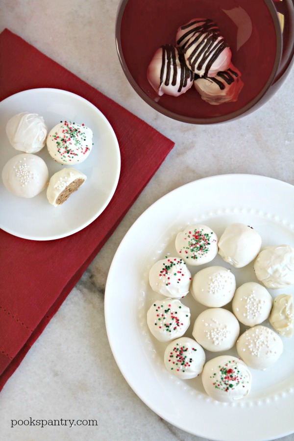 white chocolate covered rum balls on plates