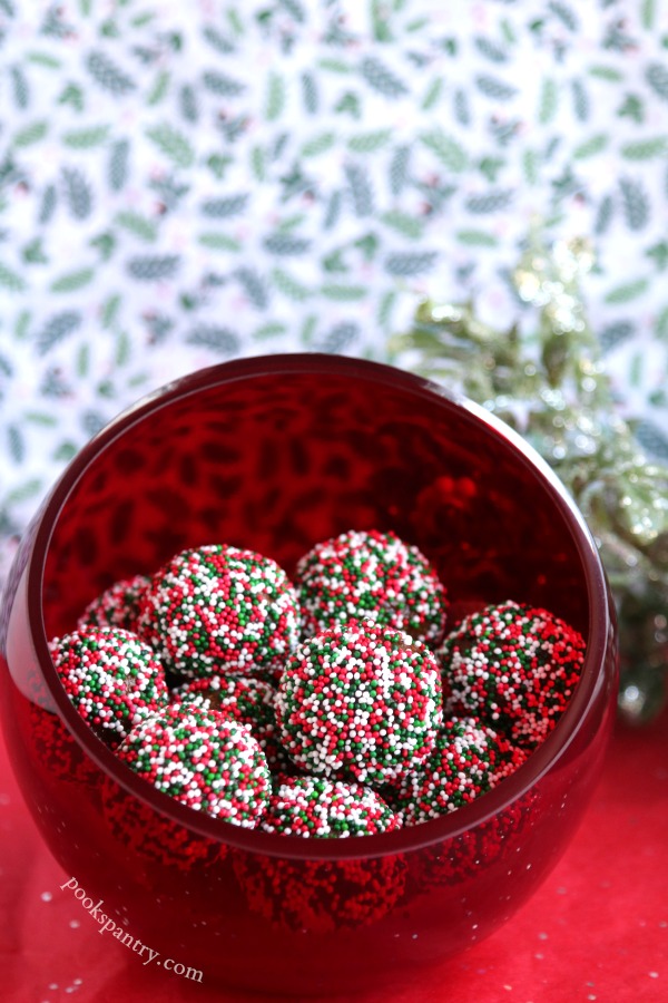 rum balls with sprinkles in red bowl