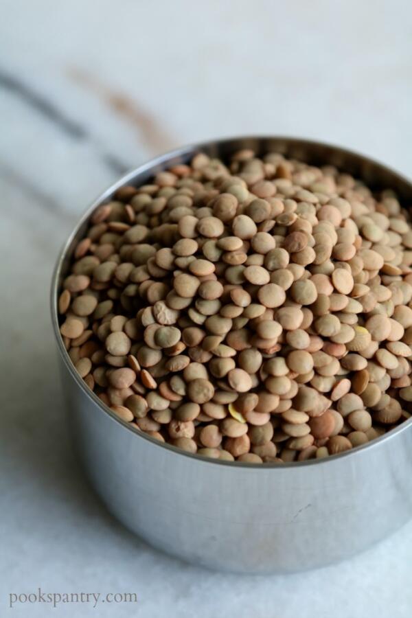 green lentils in measuring cup