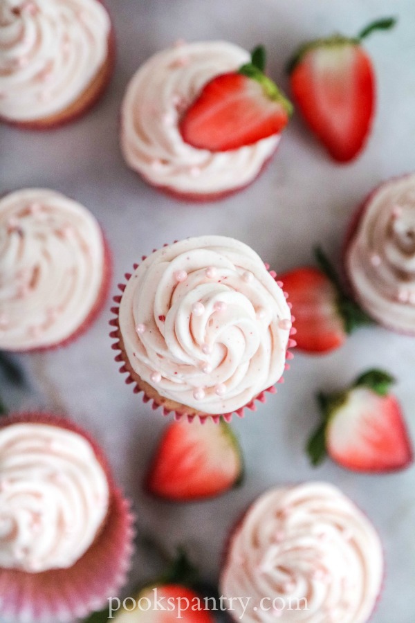 strawberry cream cheese cupcakes with pink frosting