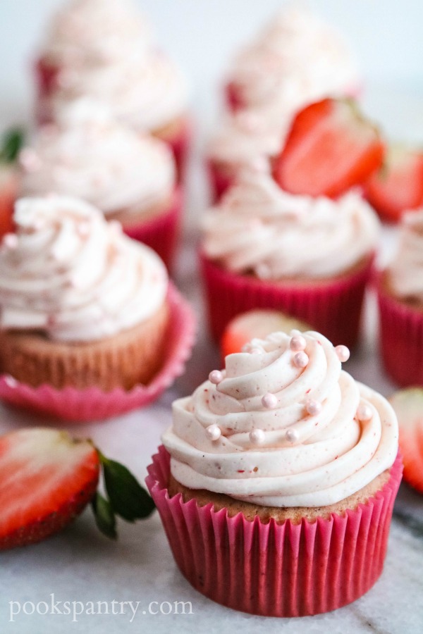 pink strawberry cream cheese cupcakes with frosting