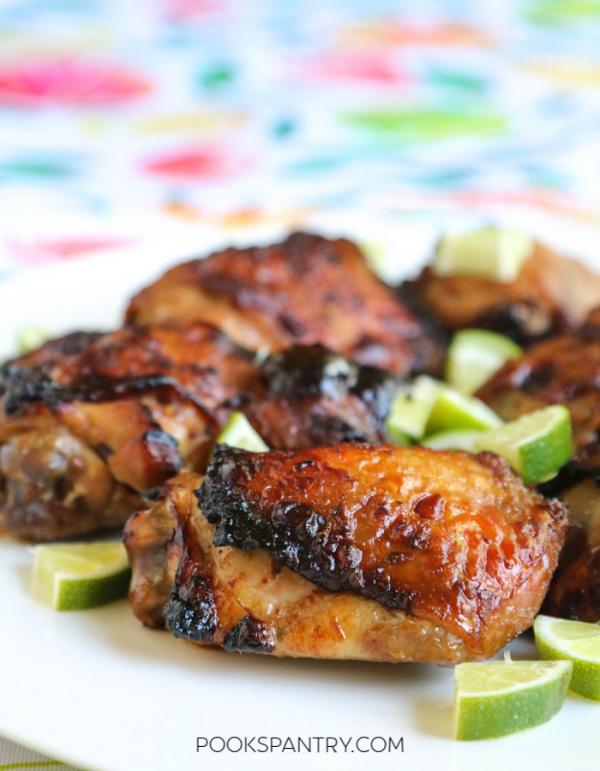 asian chicken thighs with chili, ginger & soy served with lime garnish