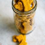 Pumpkin peanut butter dog treats in glass mason jar.