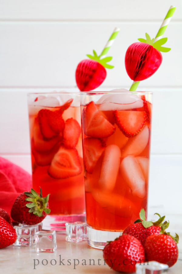 glasses of tea with strawberry straws