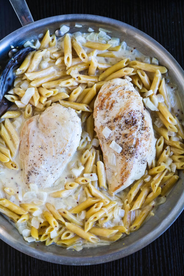 creamy chicken pasta with Dijon in pan