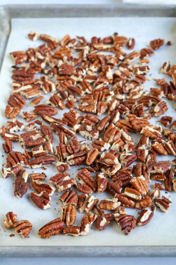 toasted pecans for butter pecan biscotti recipe on sheet pan
