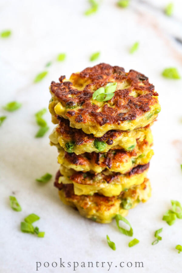 stacked curried cauliflower fritters with scallions