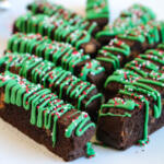 chocolate mint biscotti on white platter with red tablecloth