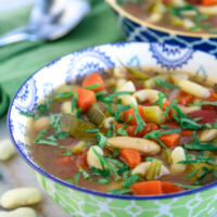 Minestrone soup from scratch in green and white bowl