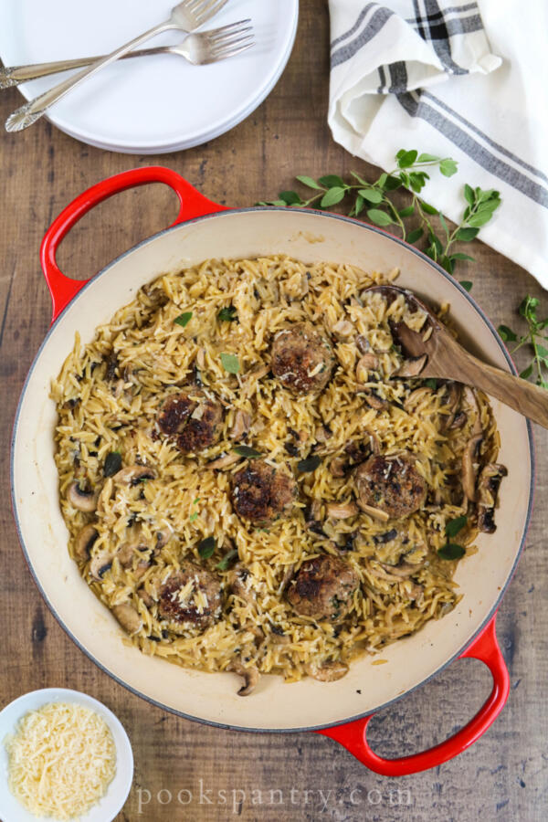 meatballs and mushroom orzo with parmesan cheese and herbs