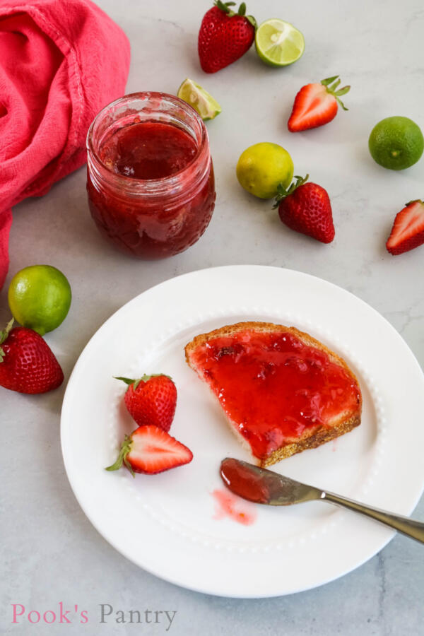 strawberry jam on bread with knife