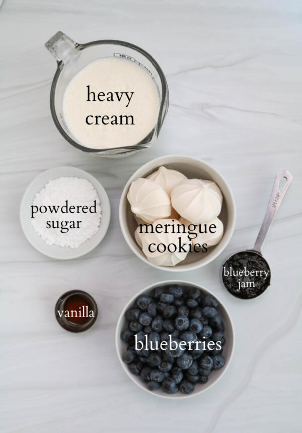 Ingredients for blueberry Eton mess on granite countertop.