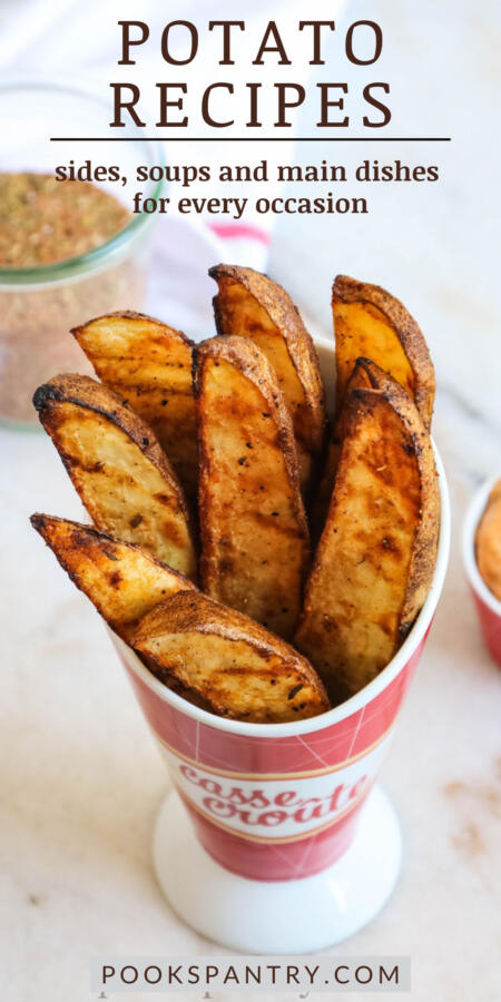 Pin image of grilled potato recipe in red and white ceramic cup.