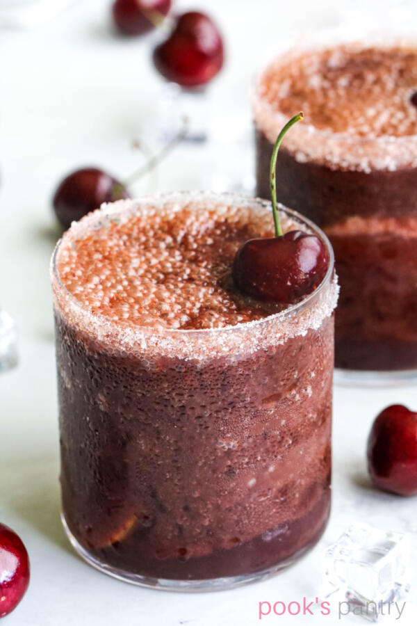 Daiquiri recipe with fresh cherries in a short, clear glass.