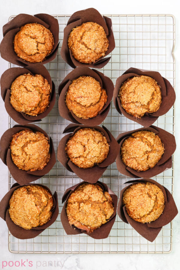 Overhead photo of pumpkin muffins on cooling rack.