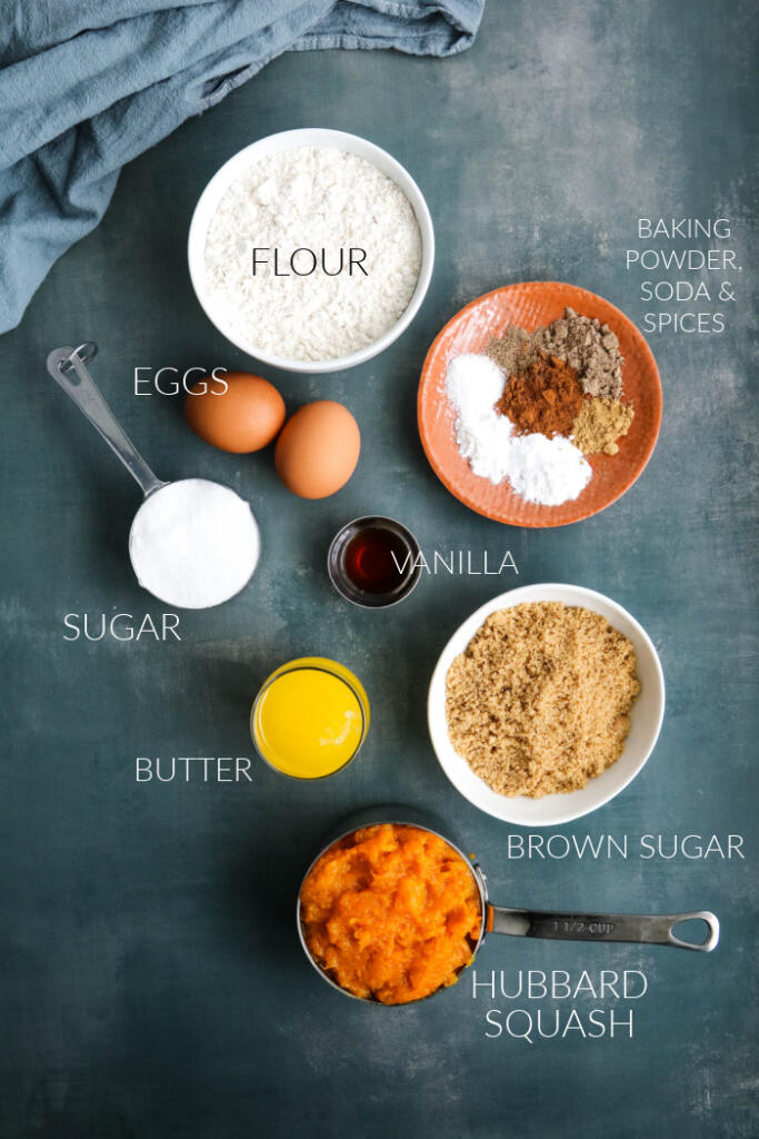 Ingredients for Hubbard squash muffins on dark gray background.