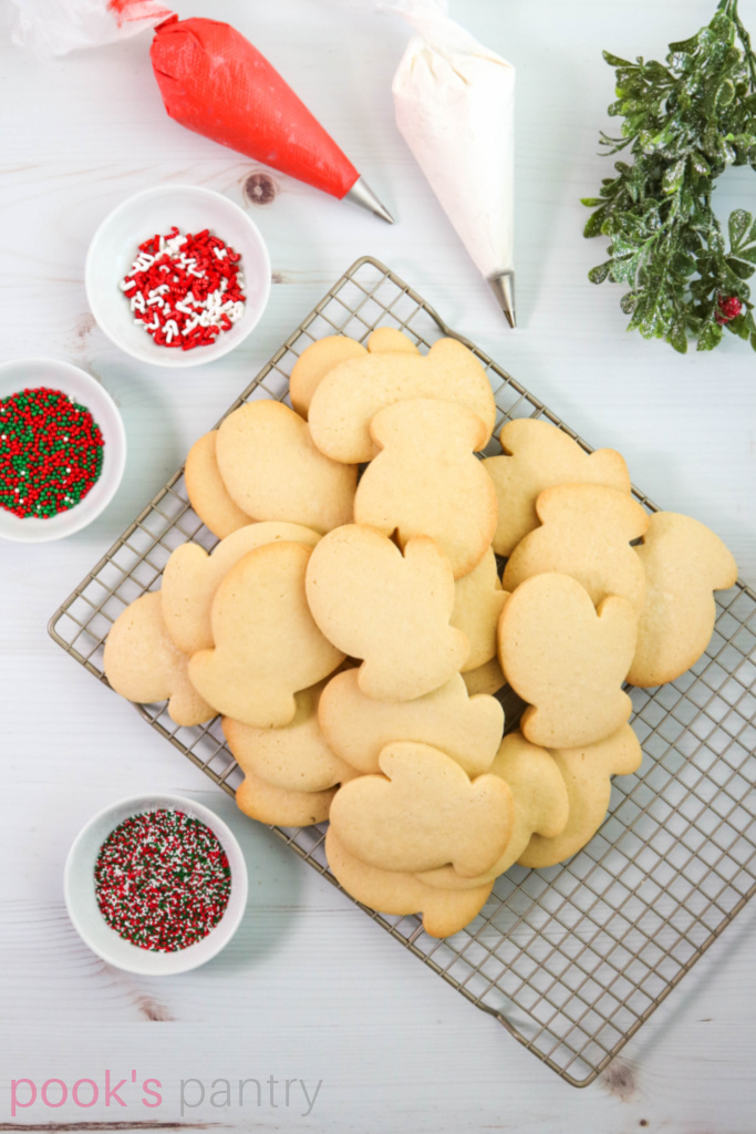 Cut out sugar Christmas cookies with sprinkles.