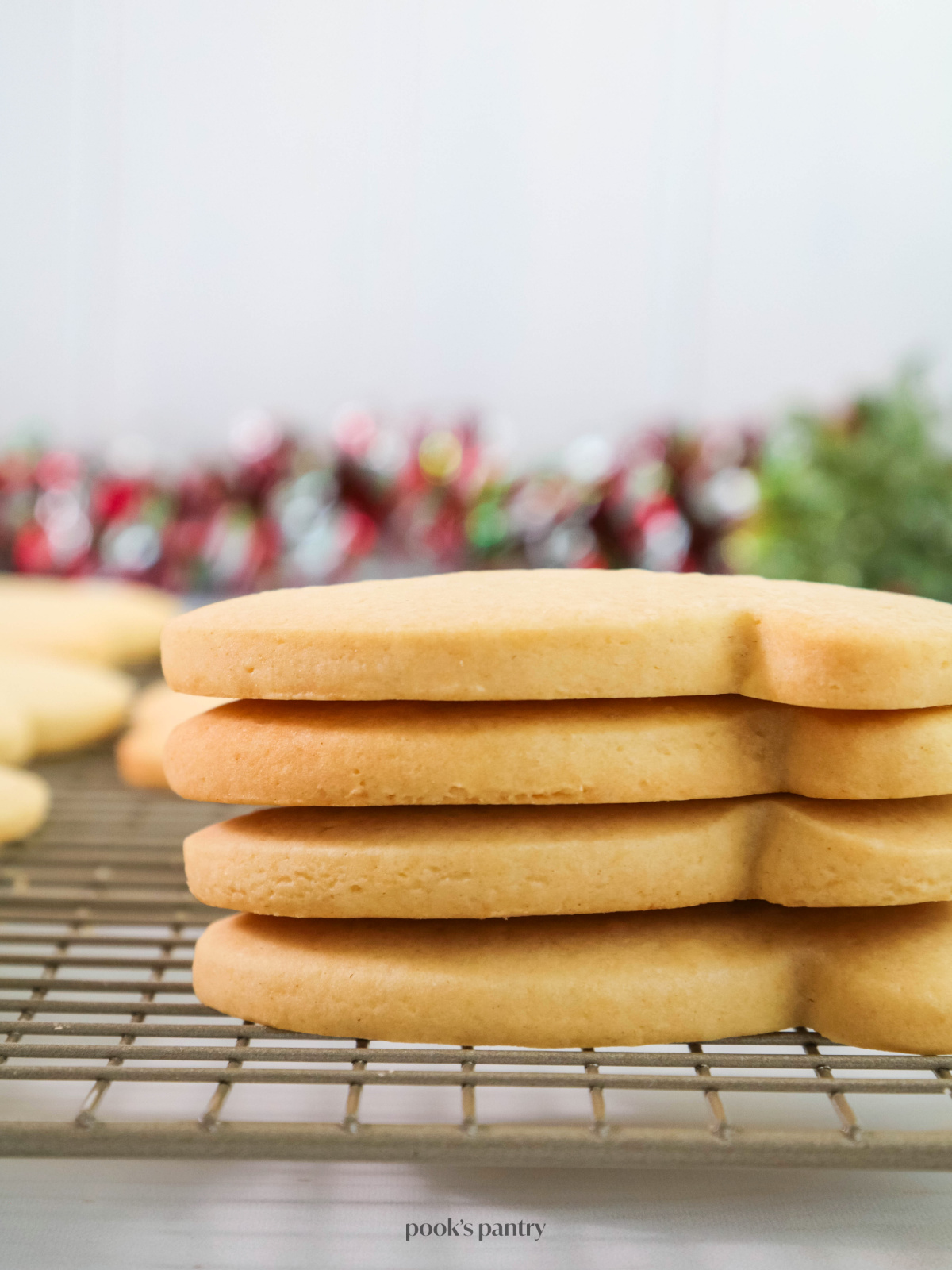 Sugar cookies stacked on top of each other showing the sides.