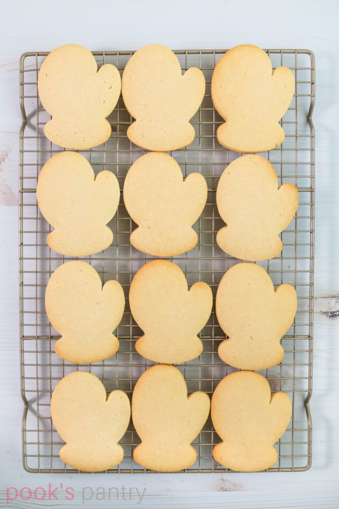 Cut out Christmas cookies on cooling rack.