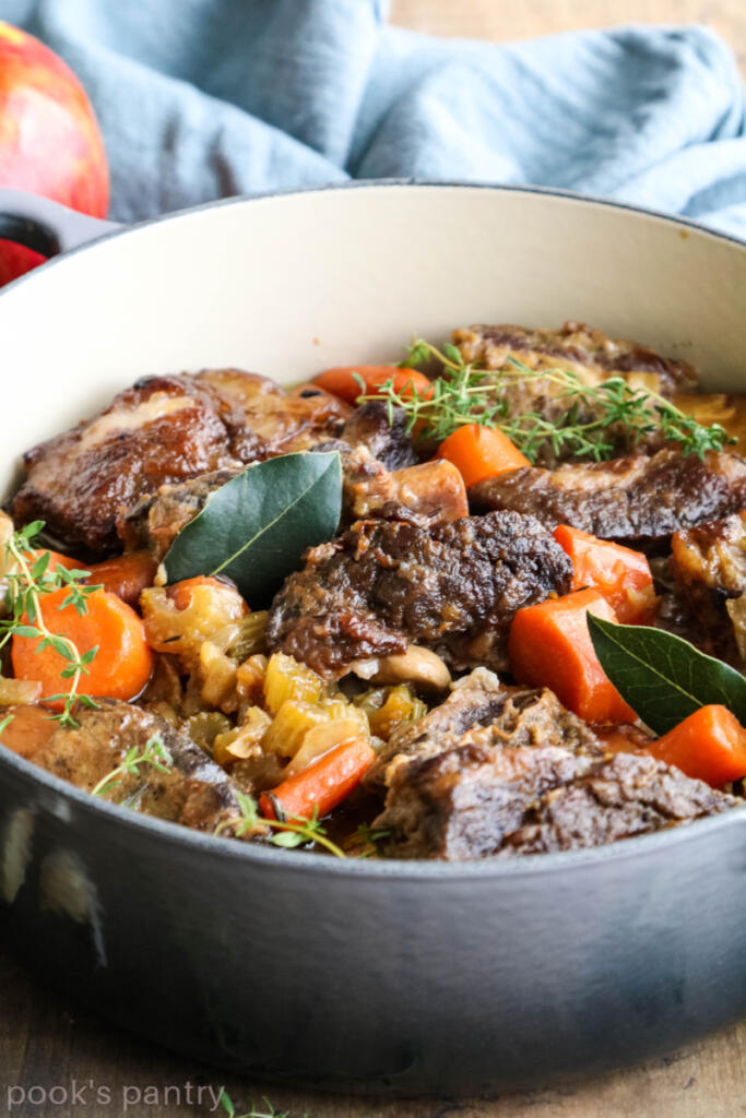 Apple cider braised short ribs in Le Creuset Dutch oven.