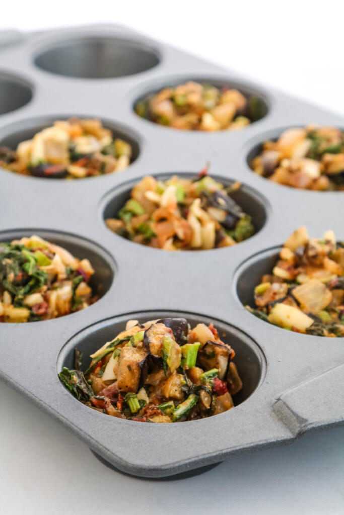 Mixed Italian vegetables in muffin tin.