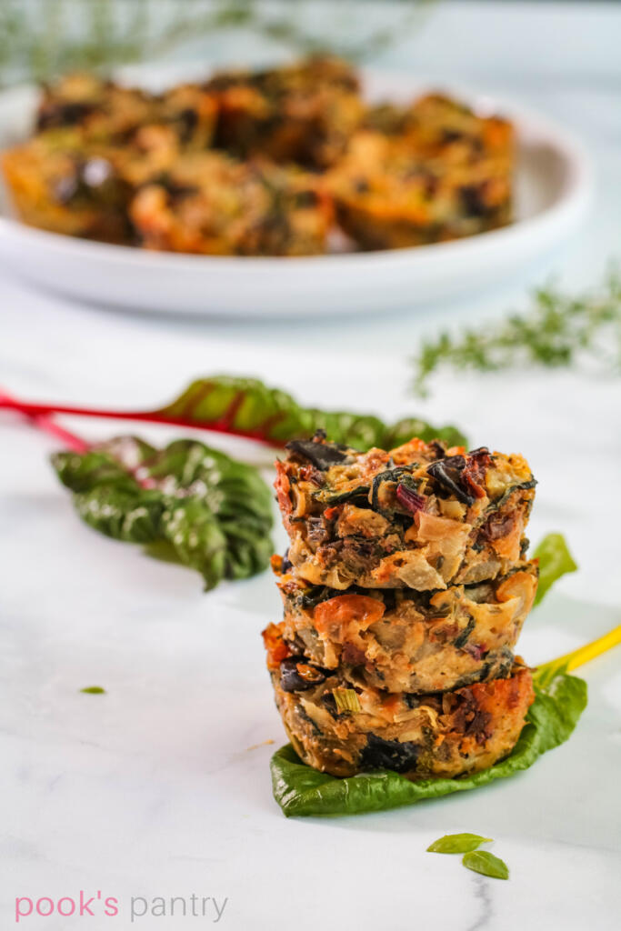Gluten free vegetable fritters on chard leaf.